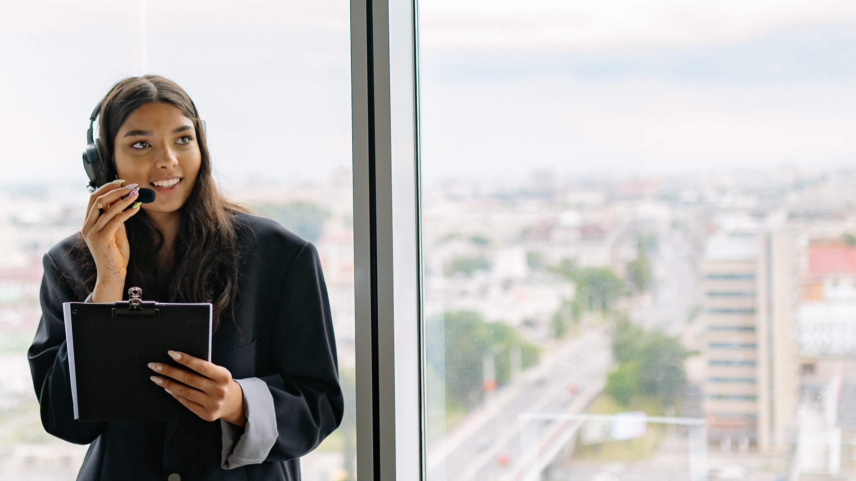 Woman with headset with city background